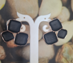 Black and gold statement studs