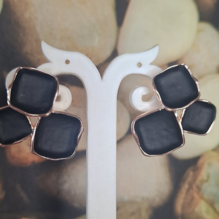 Black and gold statement studs