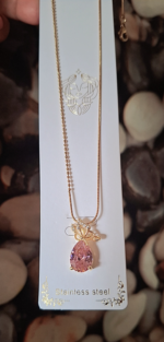Golden butterfly with pink diamond